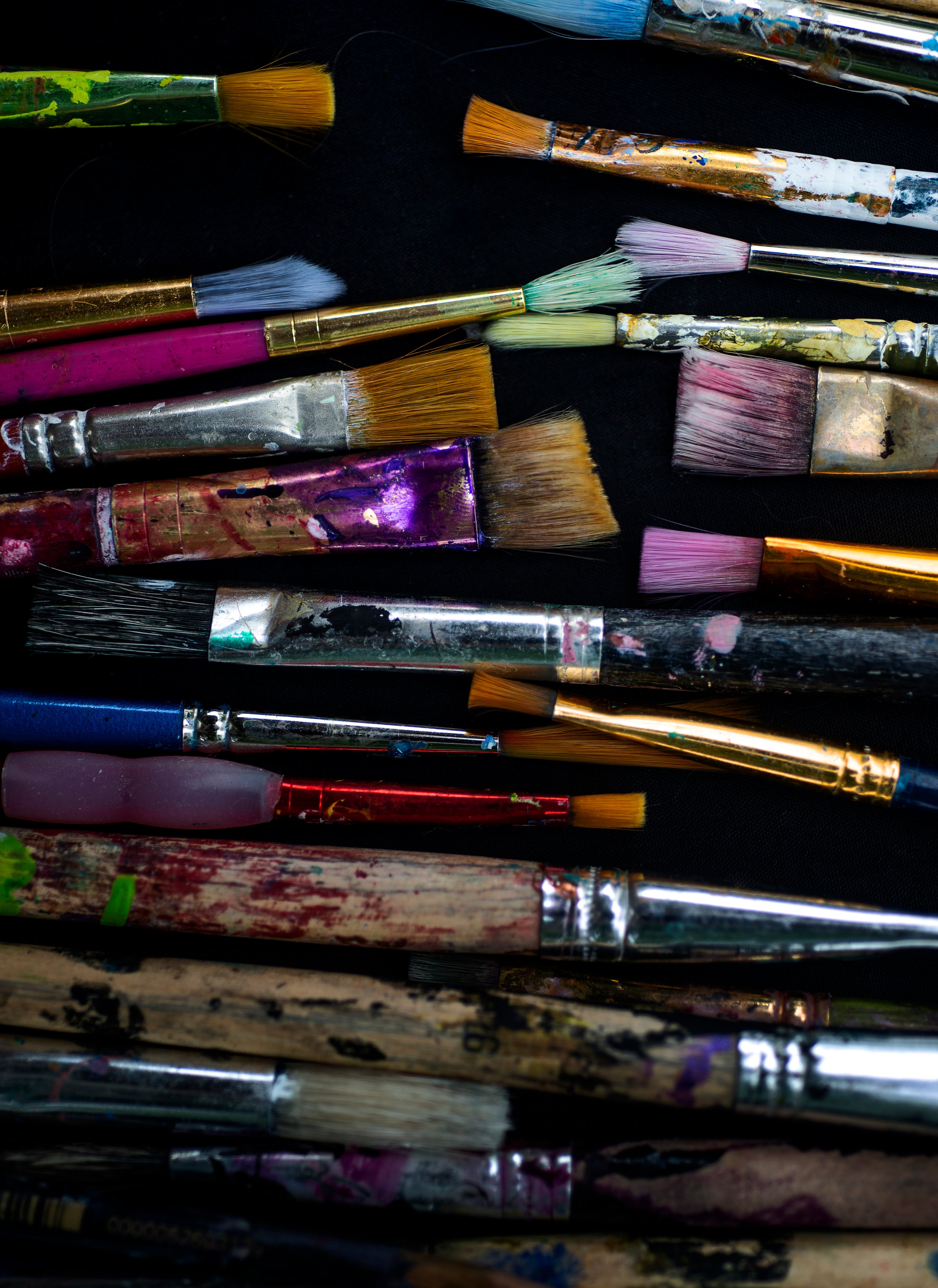 artist-paint-brushes-on-a-black-surface.jpg